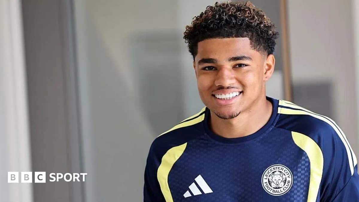 Leicester City player smiling in training kit Leicester City player smiling in training kit