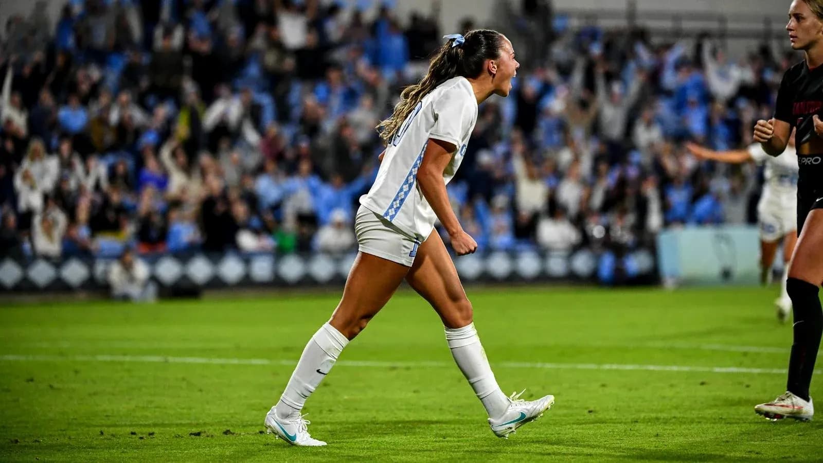 Player celebrating a goal during a match Player celebrating a goal during a match