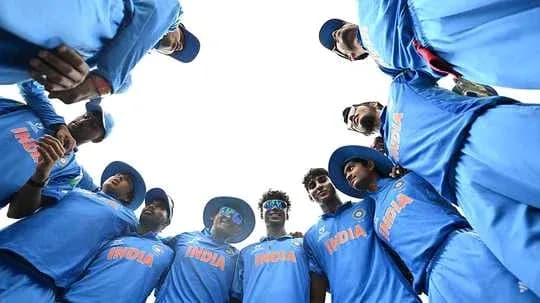 Indian cricket team huddled together before match Indian cricket team huddled together before match