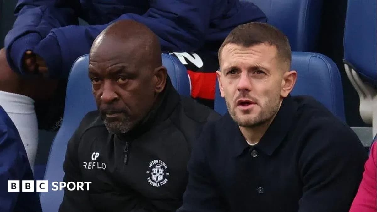 Two men sitting on the bench during a match Two men sitting on the bench during a match