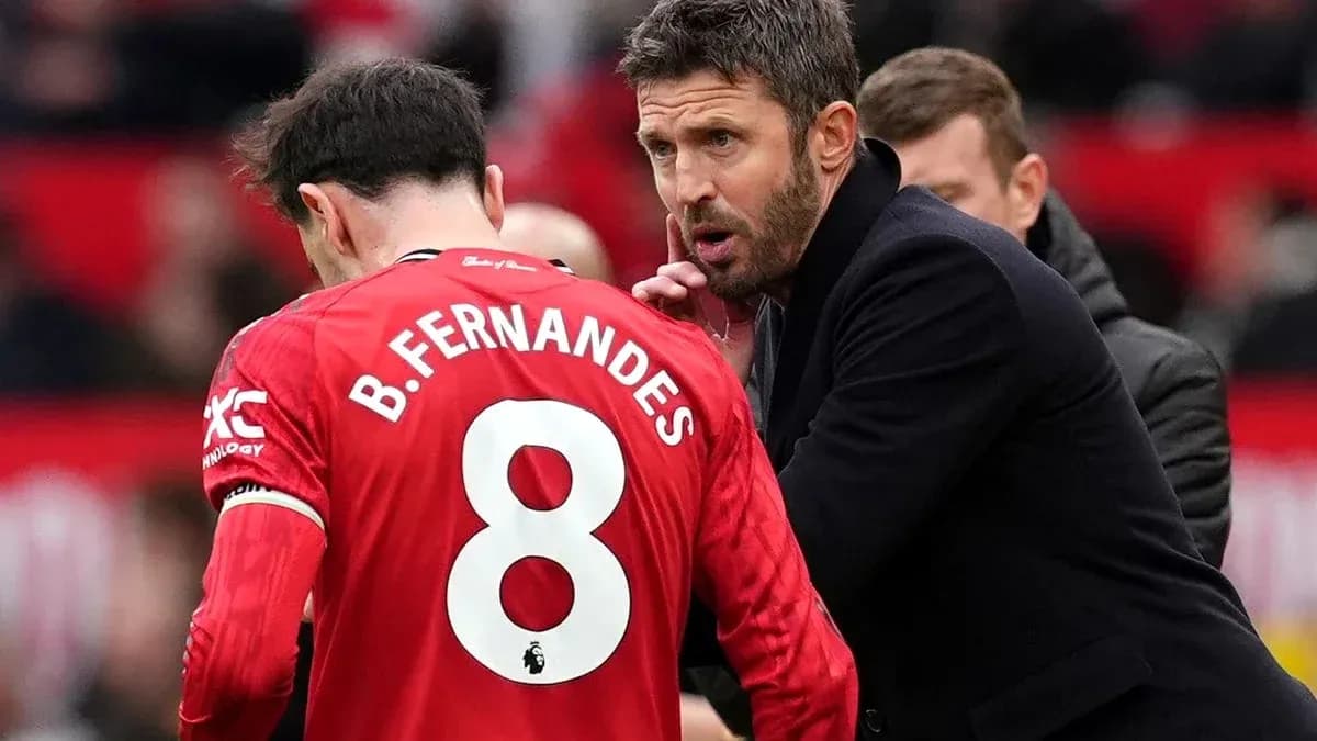 Manager giving instructions to player on sidelines Manager giving instructions to player on sidelines