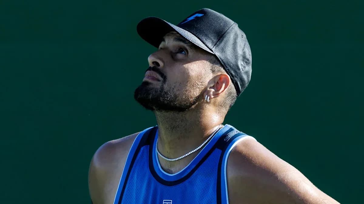 Tennis player looking up during practice session Tennis player looking up during practice session