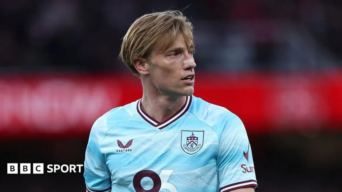 Player in light blue Burnley kit during match Player in light blue Burnley kit during match