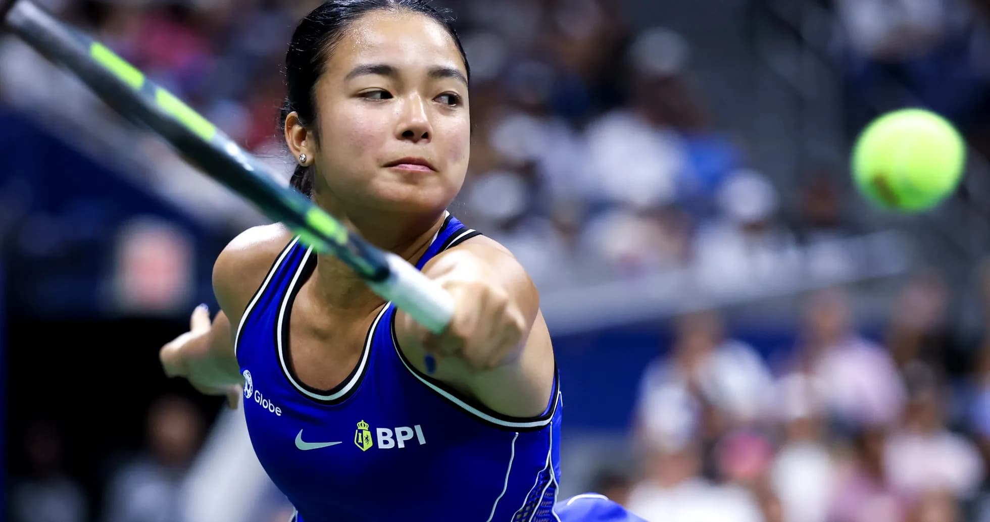 Female tennis player hitting a forehand shot Female tennis player hitting a forehand shot
