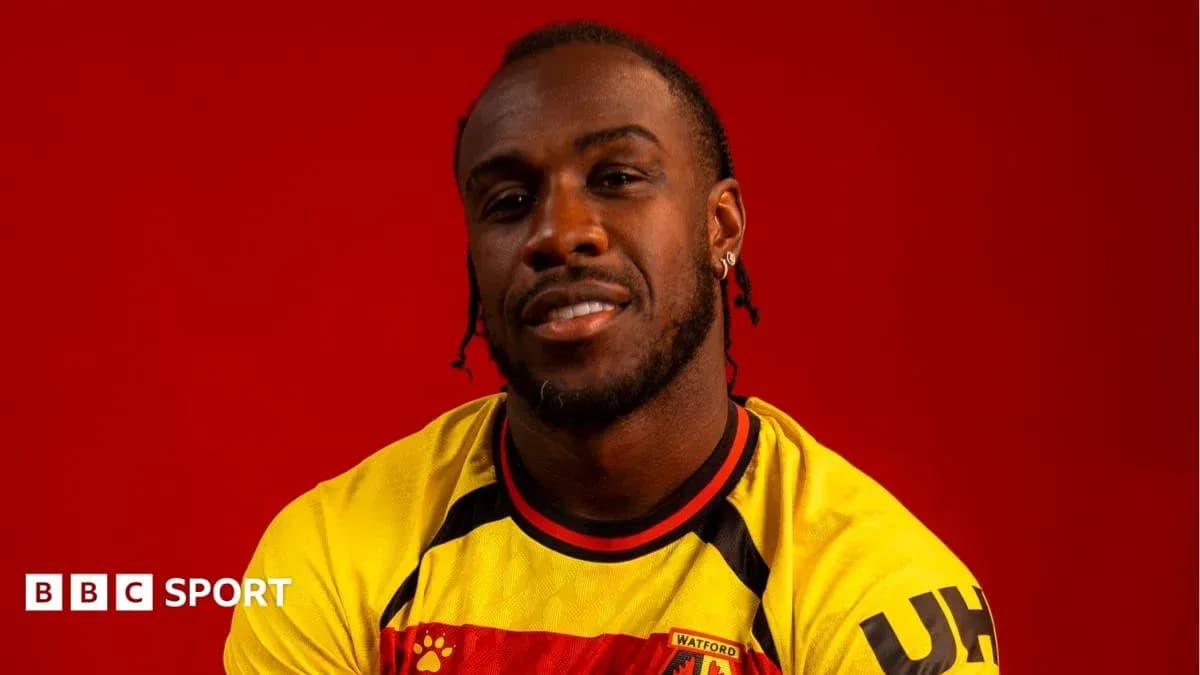 Player posing in Watford jersey against red background Player posing in Watford jersey against red background
