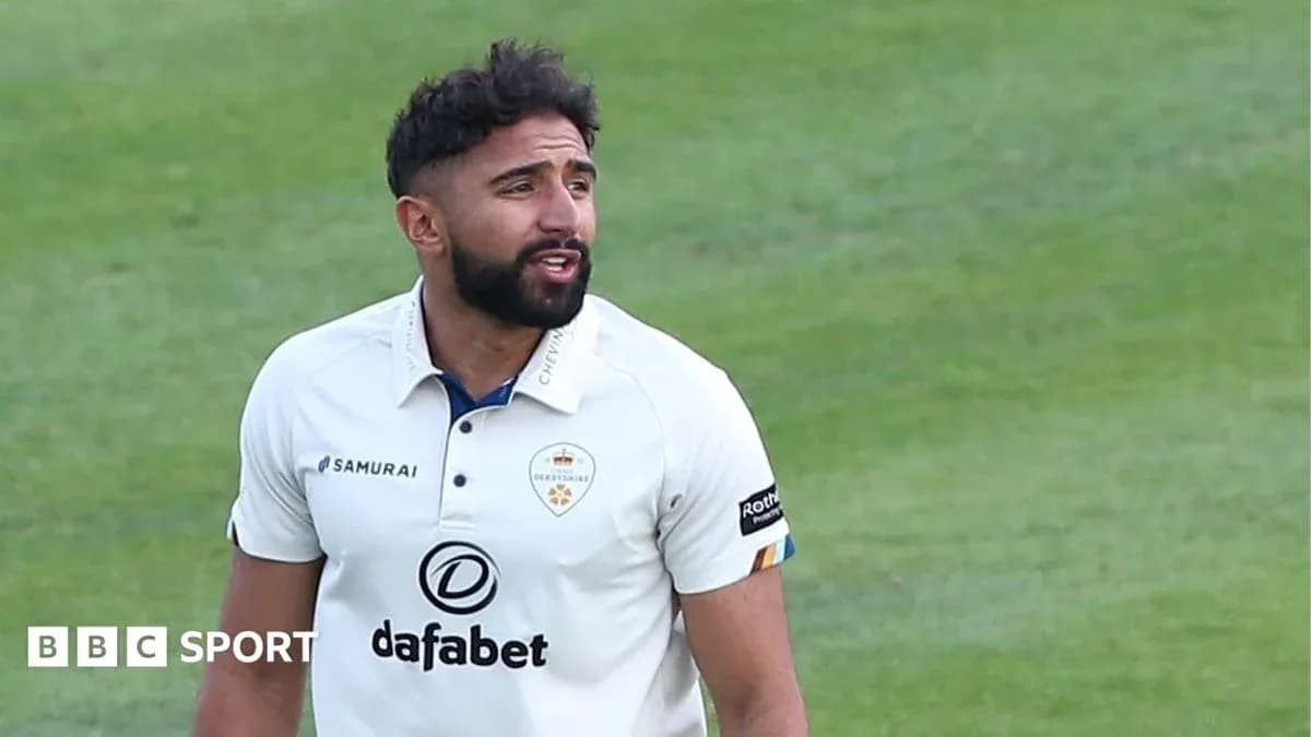 Cricketer wearing white kit on field during match Cricketer wearing white kit on field during match