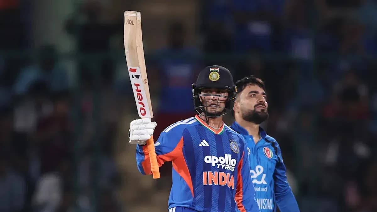 Batsman celebrating century with raised bat during match Batsman celebrating century with raised bat during match