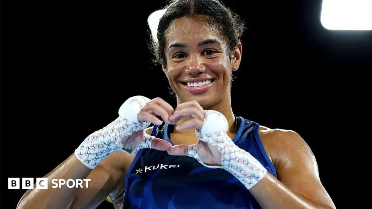Boxer making heart shape with hands after match Boxer making heart shape with hands after match