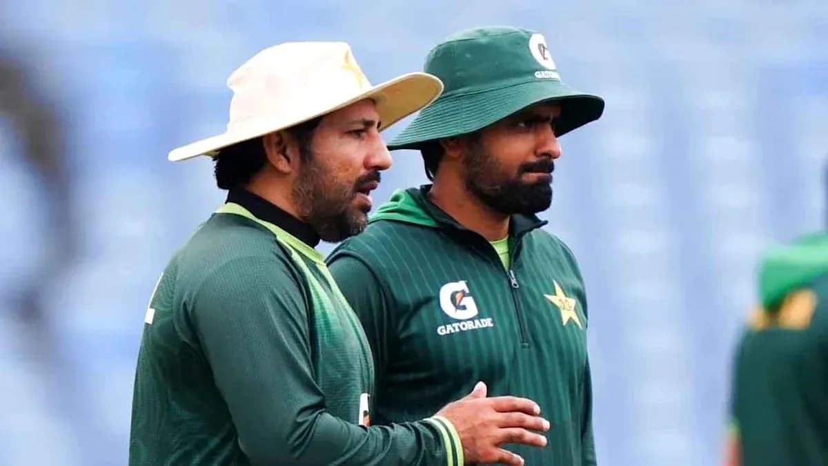 Two Pakistan cricket players discussing during practice Two Pakistan cricket players discussing during practice