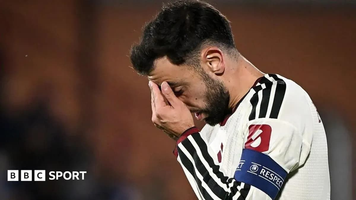 Player holding face in distress during match Player holding face in distress during match