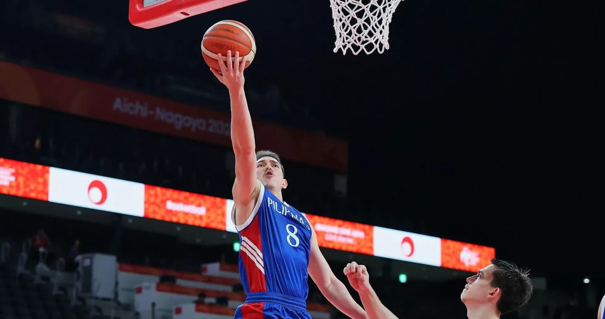 Player shooting a basketball near the hoop Player shooting a basketball near the hoop