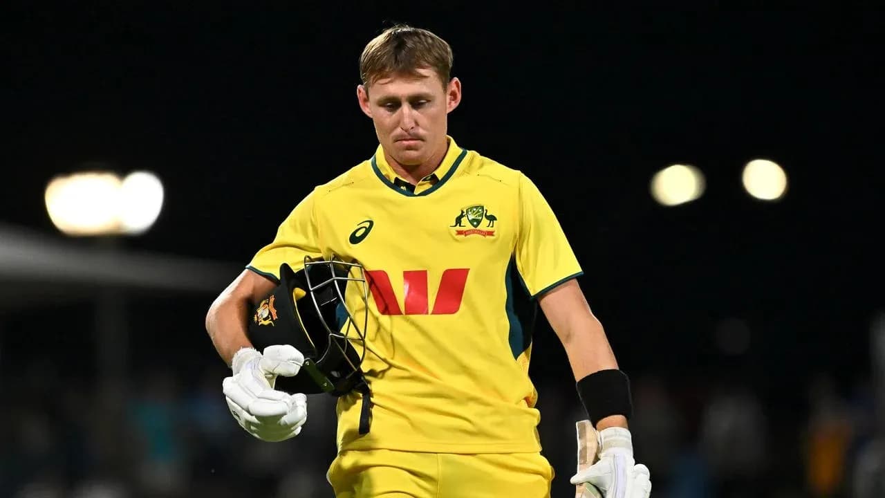 Australian cricketer walking off the field after dismissal Australian cricketer walking off the field after dismissal