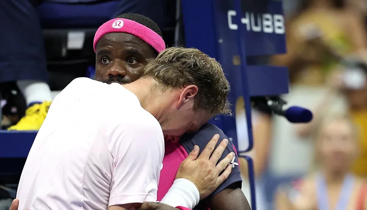 Players embracing during a tense moment on court Players embracing during a tense moment on court