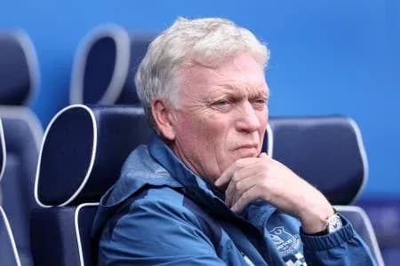Manager seated on bench during a match Manager seated on bench during a match