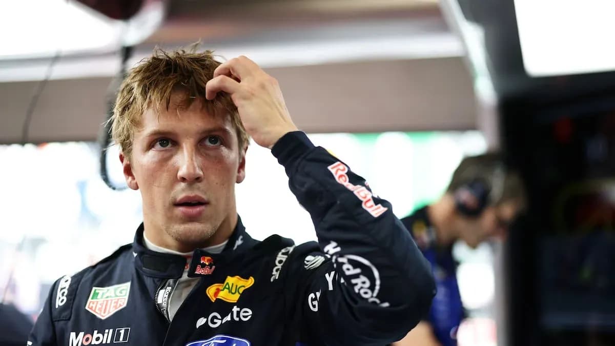Driver adjusting his hair in the garage Driver adjusting his hair in the garage