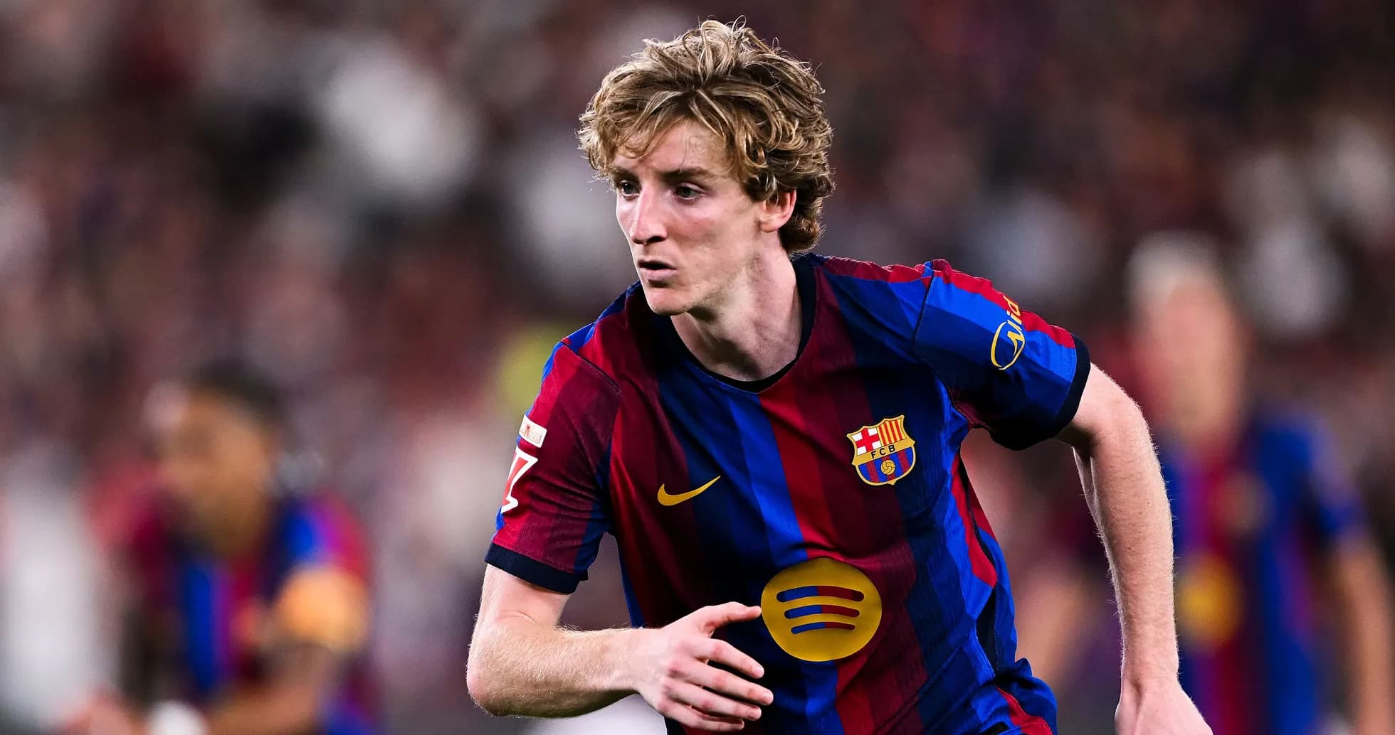 Barcelona player running during a match Barcelona player running during a match