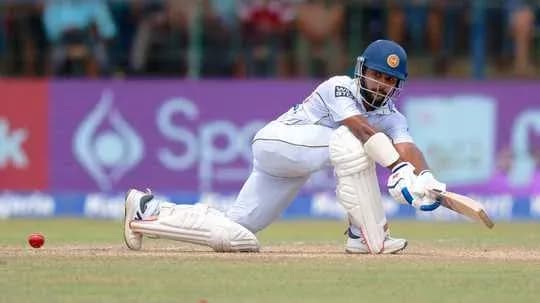 Batsman playing a defensive shot on the pitch Batsman playing a defensive shot on the pitch