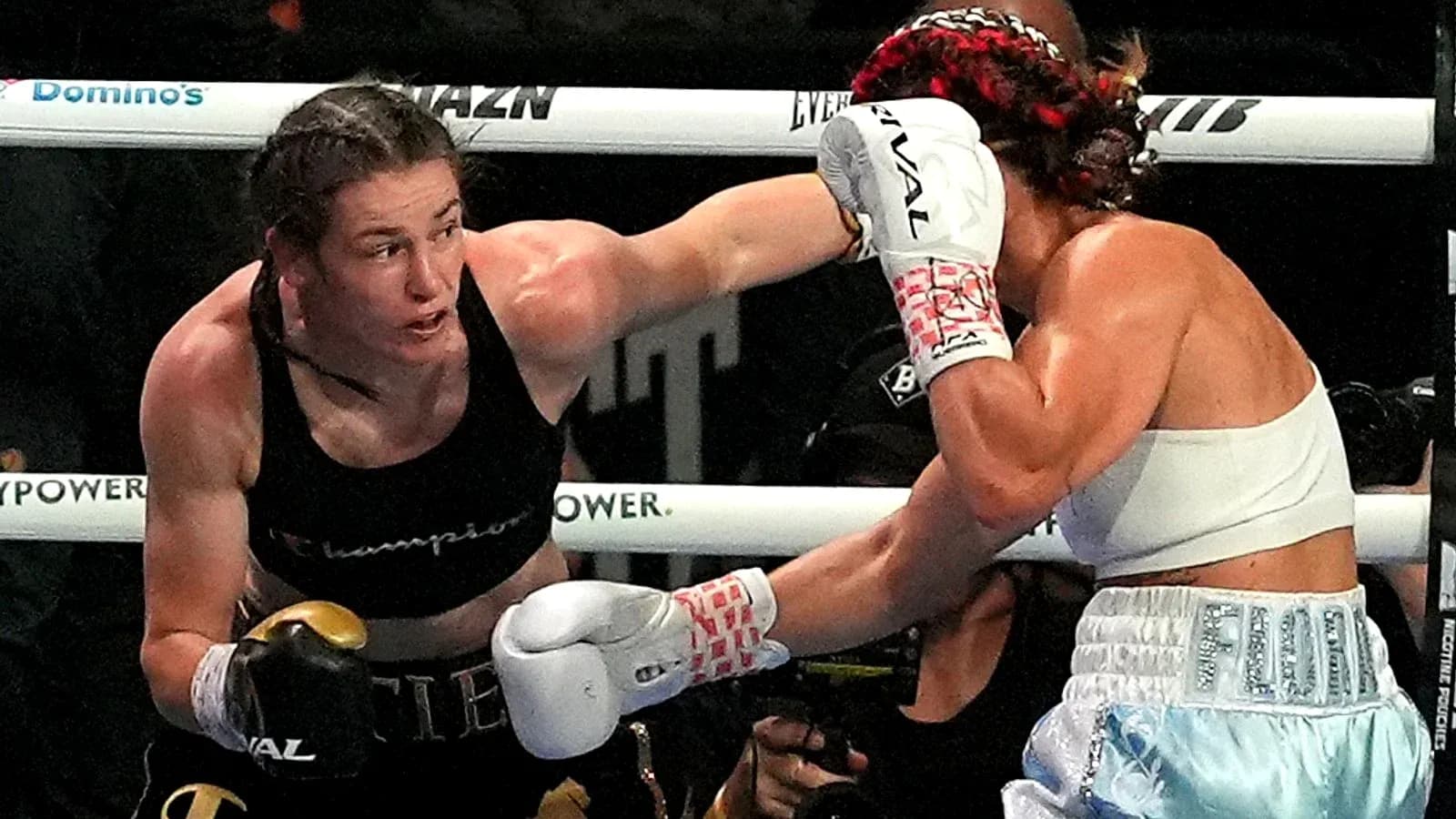 Boxers exchanging punches during a match Boxers exchanging punches during a match