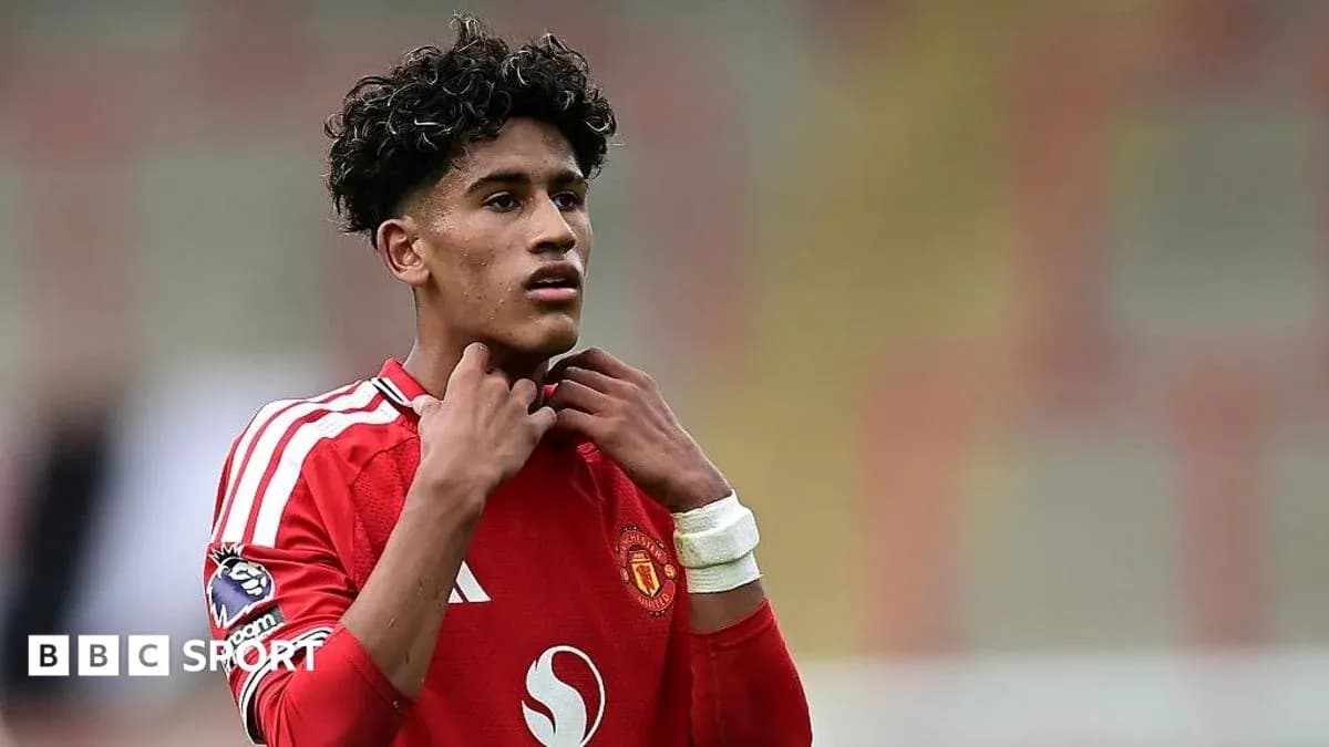 Player adjusting collar during match for Manchester United Player adjusting collar during match for Manchester United