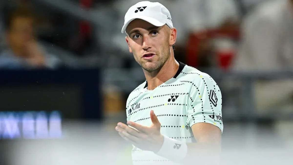 Tennis player gesturing during a match Tennis player gesturing during a match