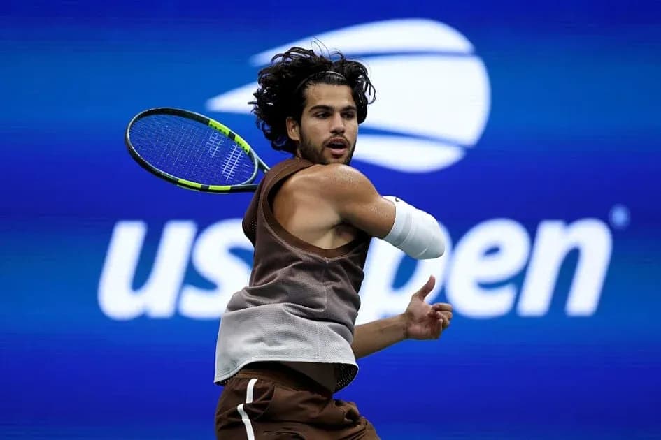 Player hitting a backhand during US Open match Player hitting a backhand during US Open match