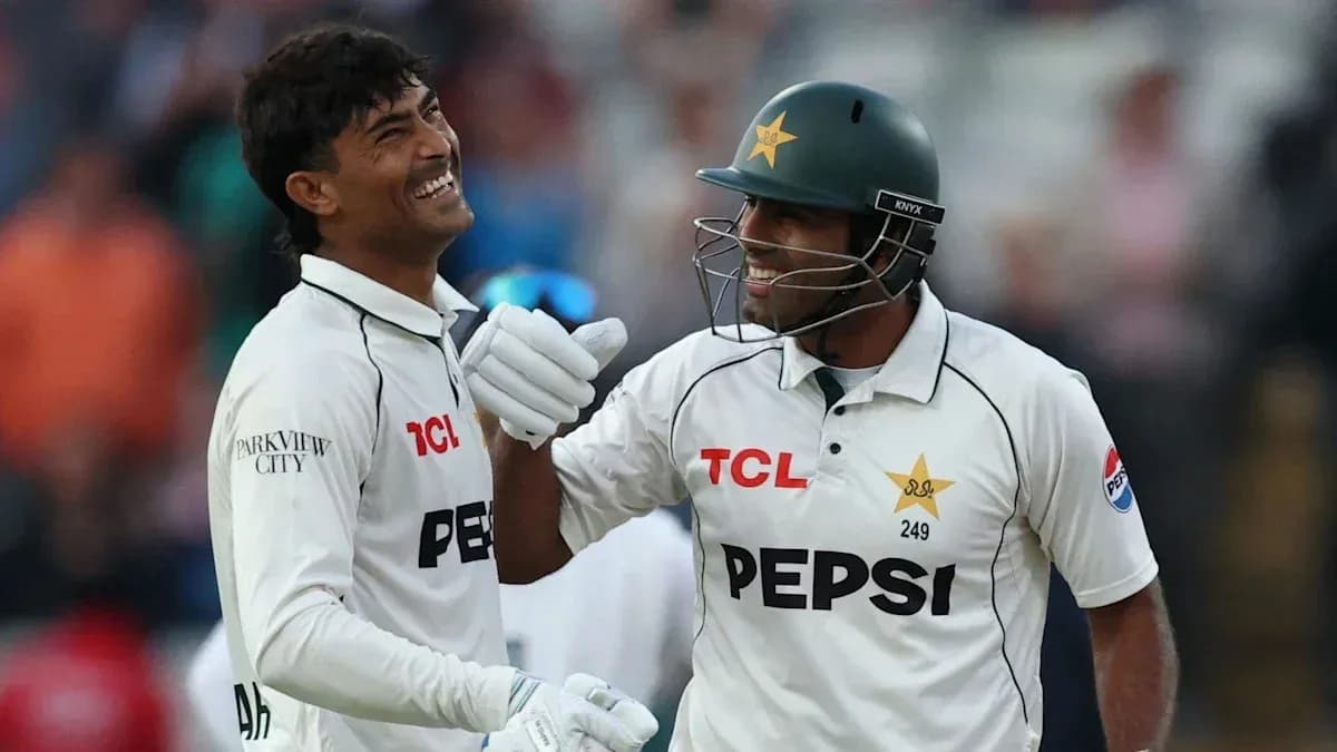 Two Pakistan cricket players celebrating together on field Two Pakistan cricket players celebrating together on field