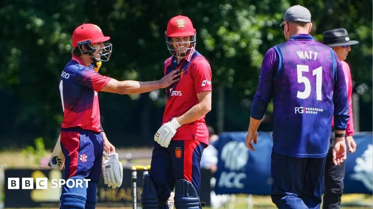 Players interacting during a cricket match Players interacting during a cricket match