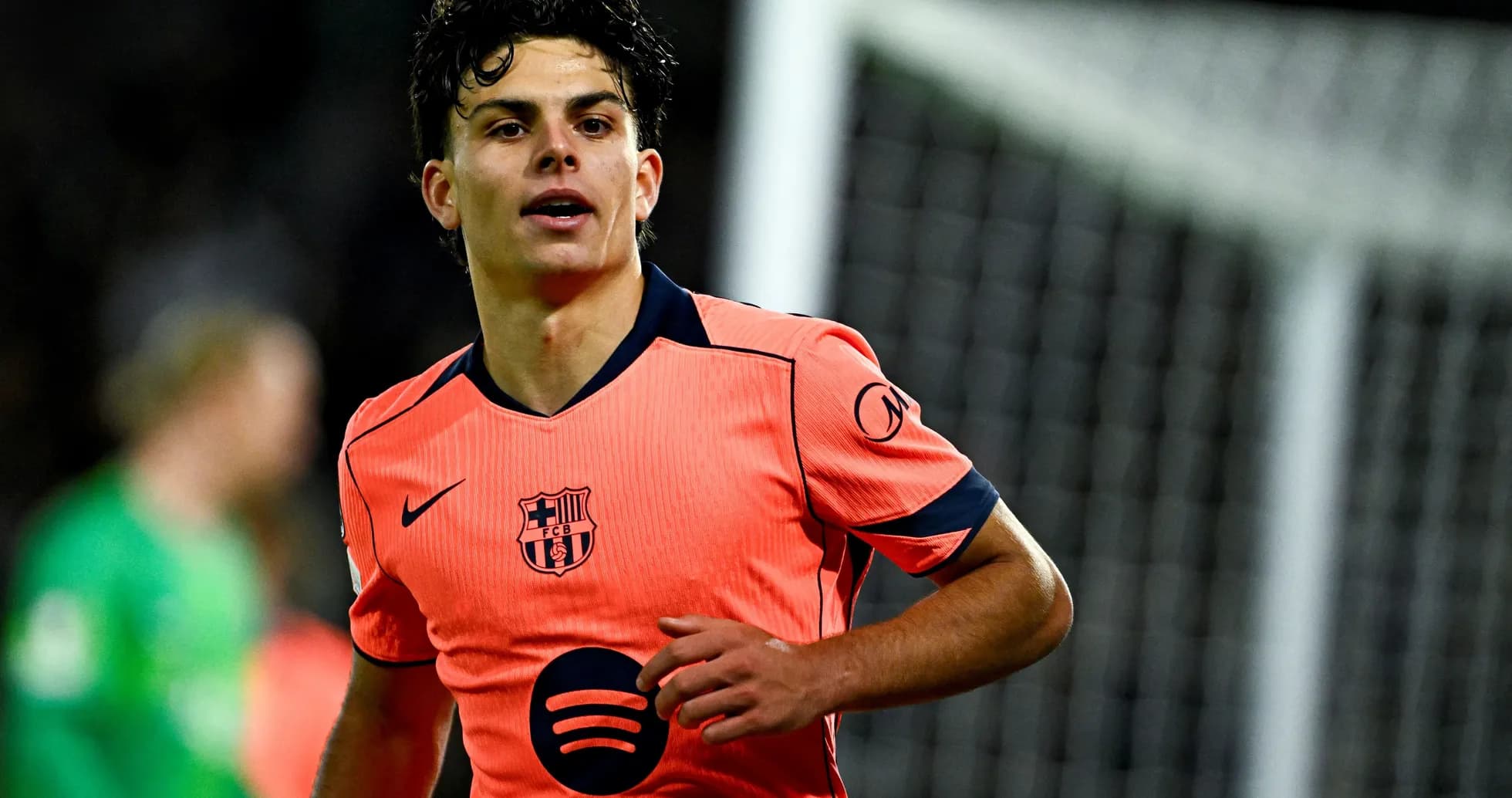 Player in orange Barcelona kit during match Player in orange Barcelona kit during match
