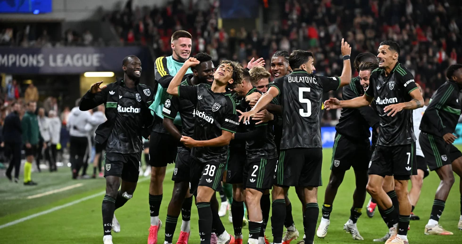 Players celebrating after scoring a goal in match Players celebrating after scoring a goal in match