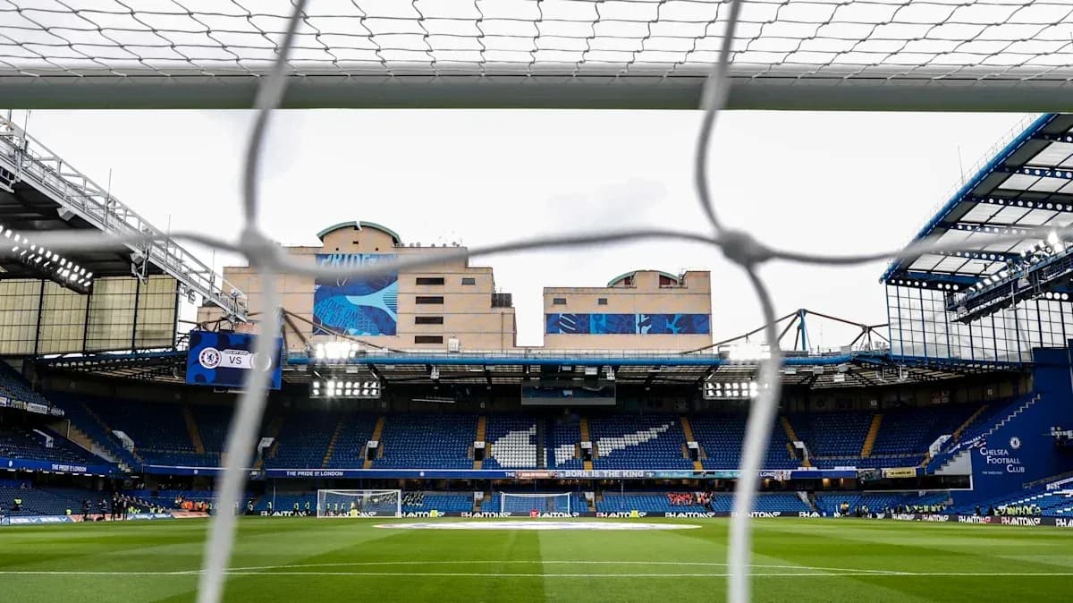View of Stamford Bridge stadium through goal net View of Stamford Bridge stadium through goal net