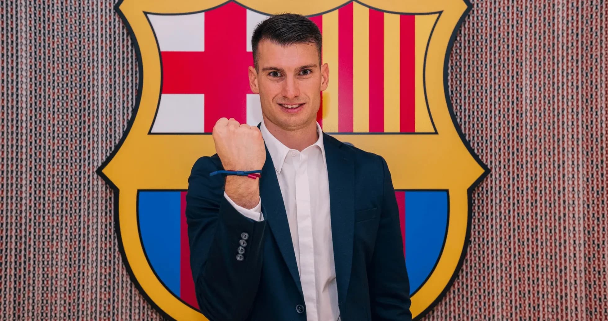New player posing with FC Barcelona logo backdrop New player posing with FC Barcelona logo backdrop