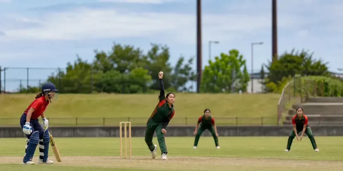 Bowler delivering a ball in cricket match Bowler delivering a ball in cricket match