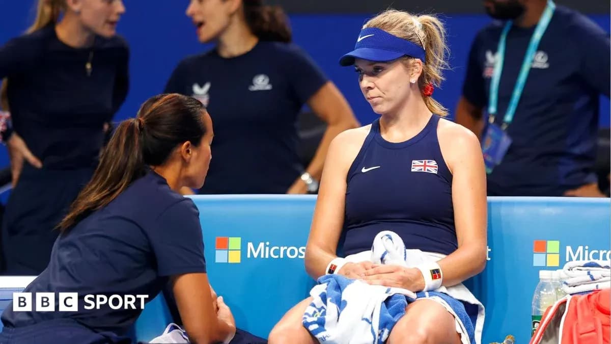 Player seated during a break with coach Player seated during a break with coach