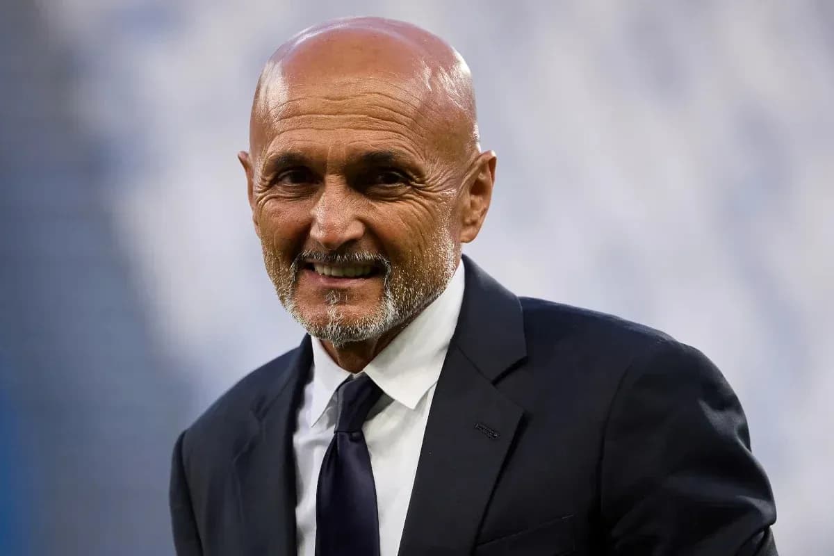 Coach smiling in a formal suit at stadium Coach smiling in a formal suit at stadium