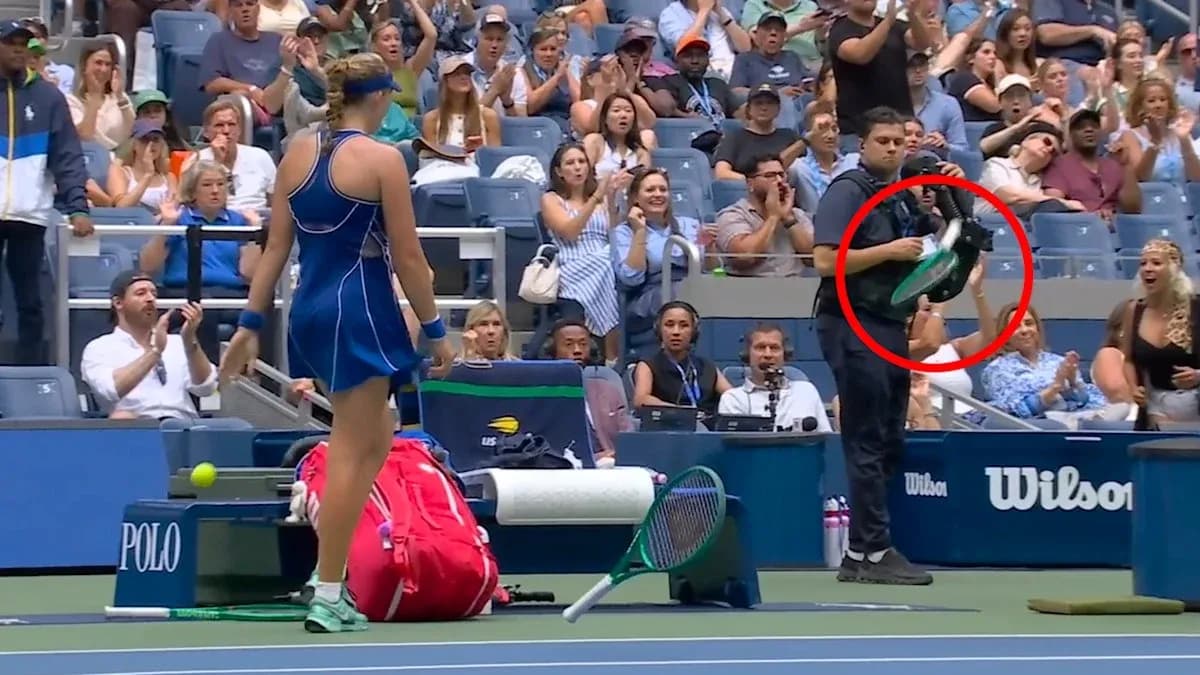 Tennis player preparing to serve with audience applauding Tennis player preparing to serve with audience applauding