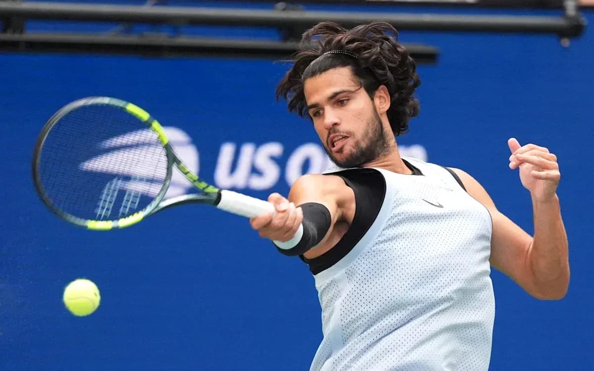 Player hitting a forehand during a tennis match Player hitting a forehand during a tennis match