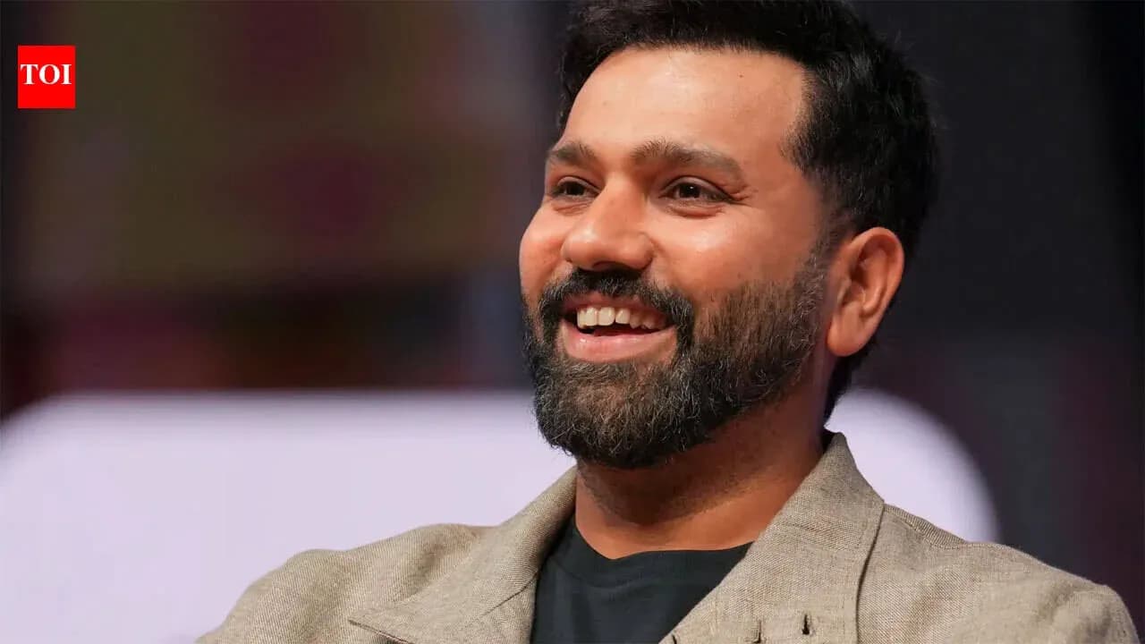 Smiling man in a beige blazer during event Smiling man in a beige blazer during event