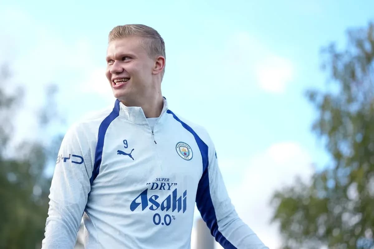 Player smiling during training session in Manchester City kit Player smiling during training session in Manchester City kit