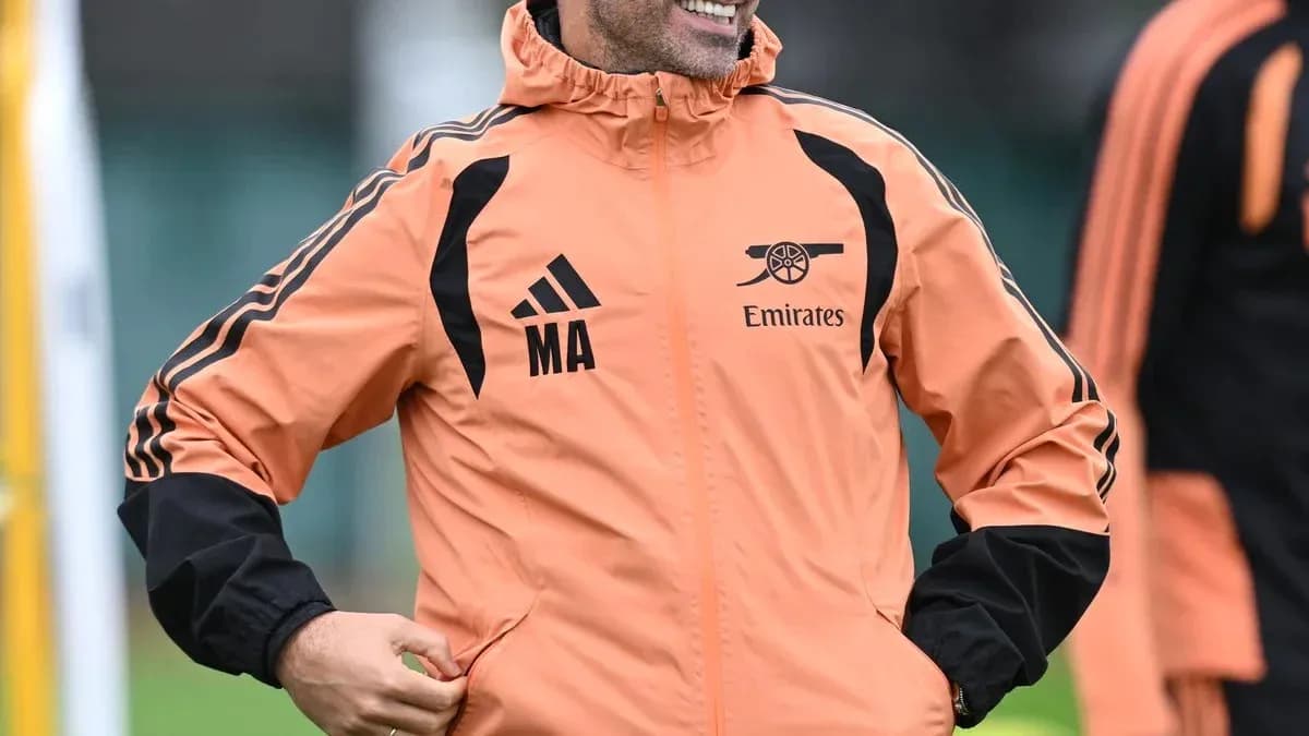 Coach in training jacket smiling during session Coach in training jacket smiling during session