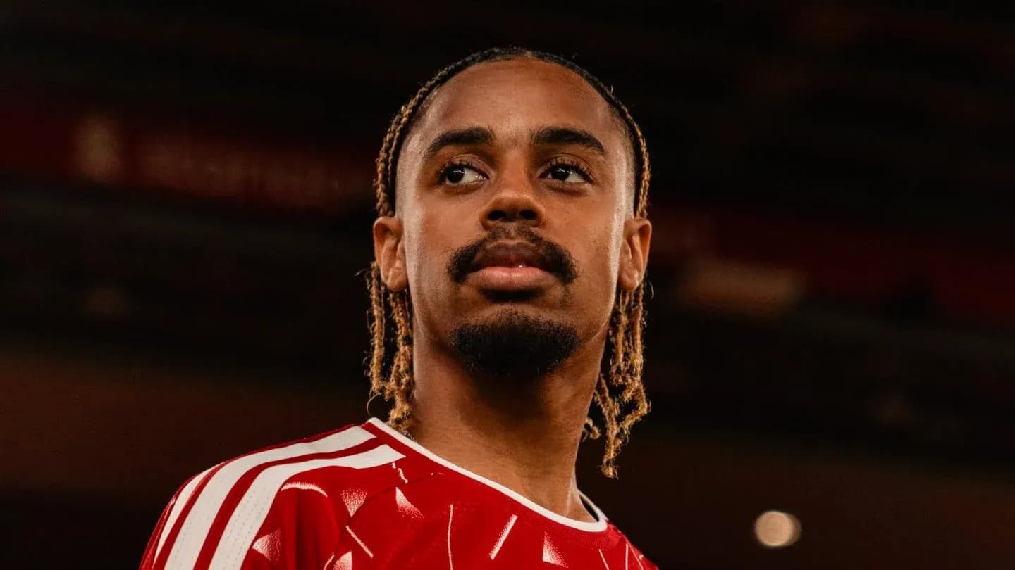 Player in red jersey posing for portrait Player in red jersey posing for portrait