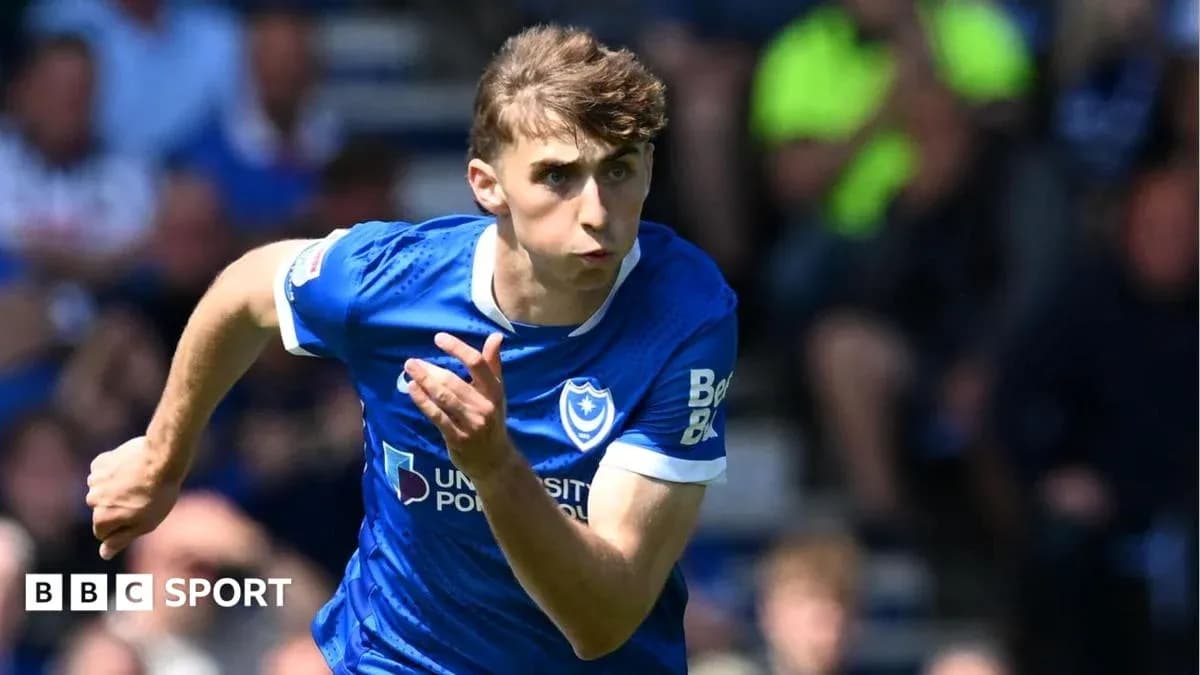 Player running during a match for Portsmouth Player running during a match for Portsmouth