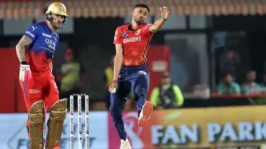 Bowler delivering a ball to batsman during match Bowler delivering a ball to batsman during match