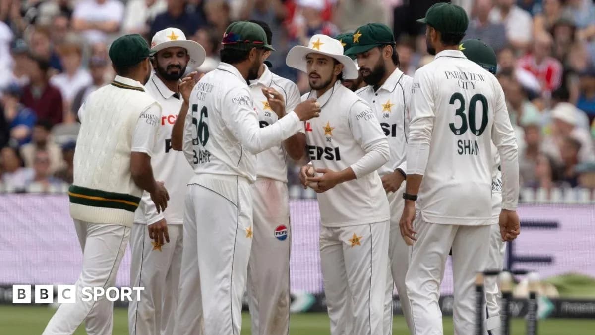 Pakistani cricket team discussing strategy on field Pakistani cricket team discussing strategy on field