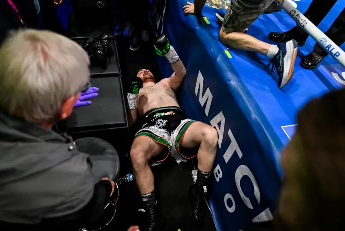 Boxer lying on the floor after the match Boxer lying on the floor after the match