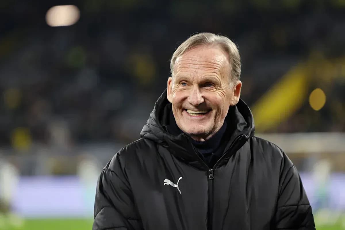 Man smiling on the sidelines during a match Man smiling on the sidelines during a match