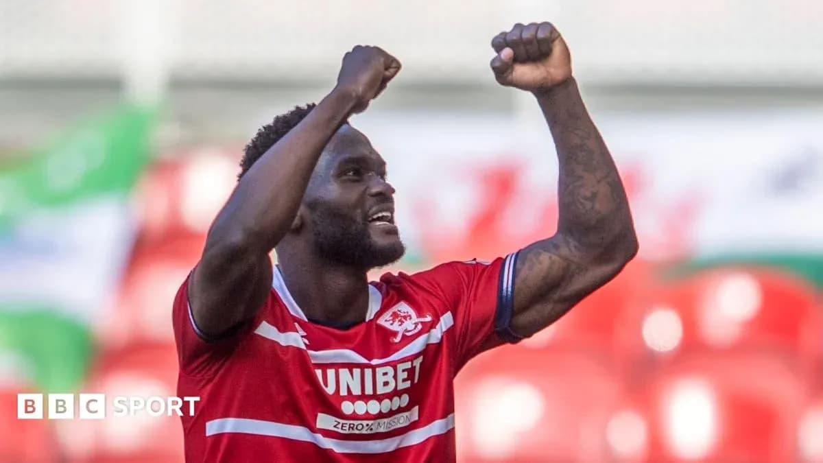 Player celebrating with raised fists after scoring Player celebrating with raised fists after scoring