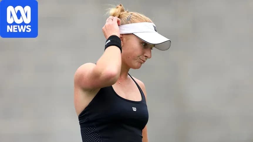 Tennis player adjusting cap during a match Tennis player adjusting cap during a match