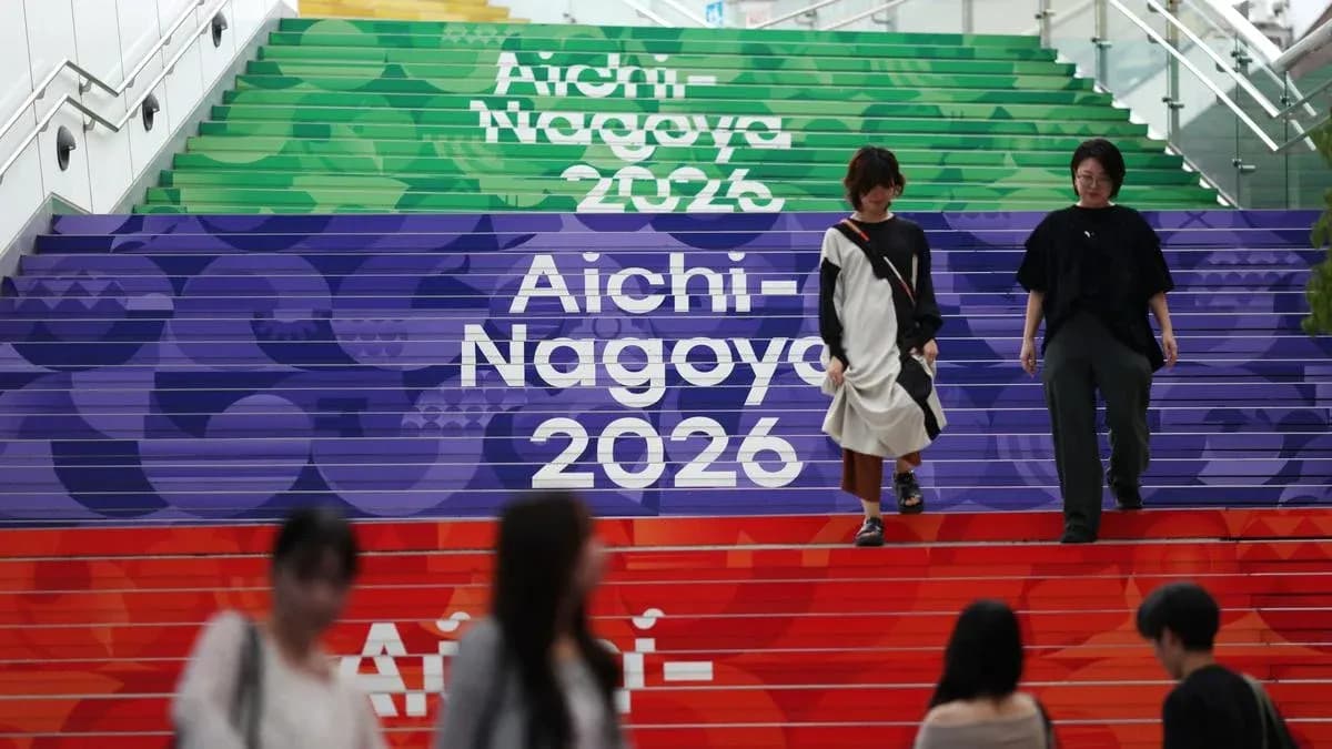 People walking down colorful stairs with Aichi-Nagoya 2026 People walking down colorful stairs with Aichi-Nagoya 2026
