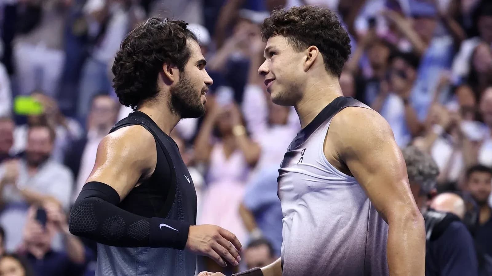 Two tennis players shaking hands after match Two tennis players shaking hands after match