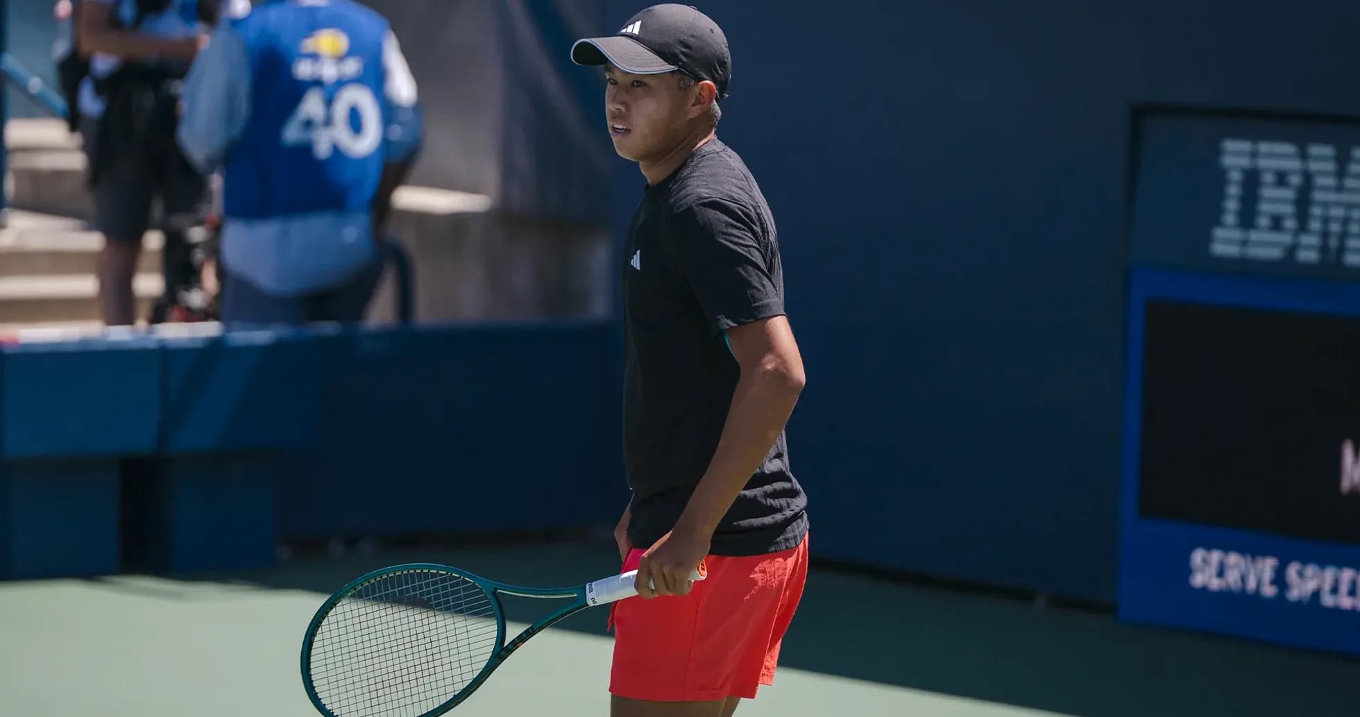 Tennis player preparing to serve on court Tennis player preparing to serve on court
